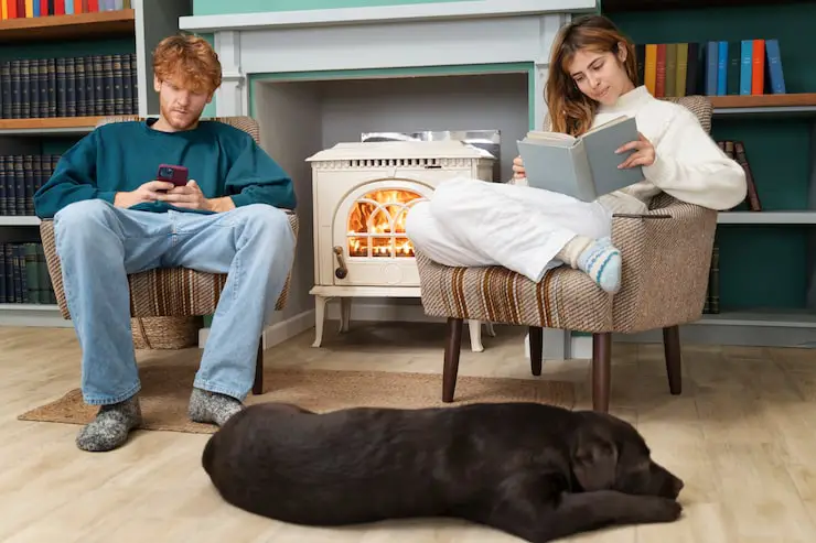 People relaxing near a warm stove/furnace.